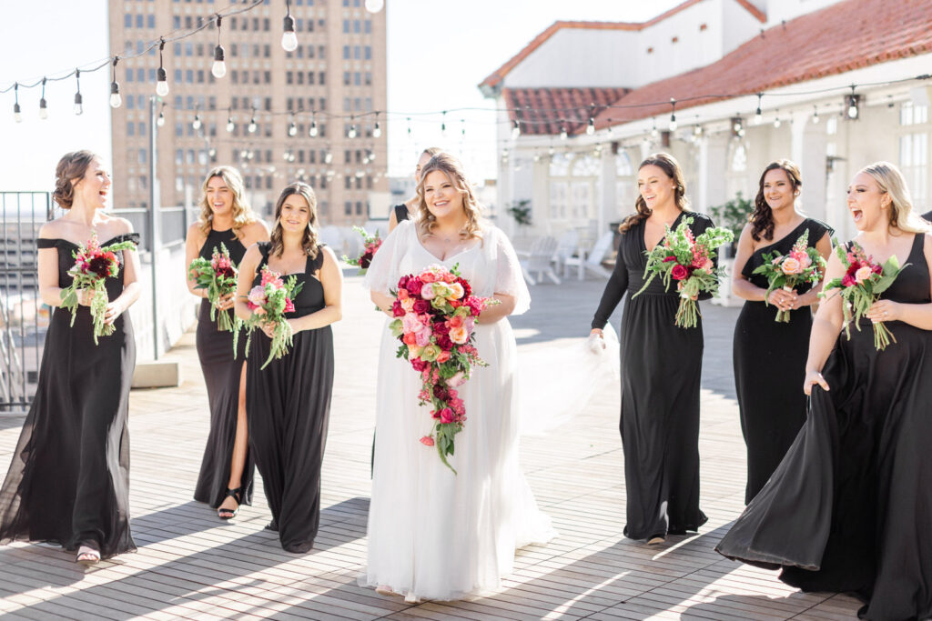Bride and Bridesmaids walking on Sky Terrace rooftop at St. Anthony Hotel
