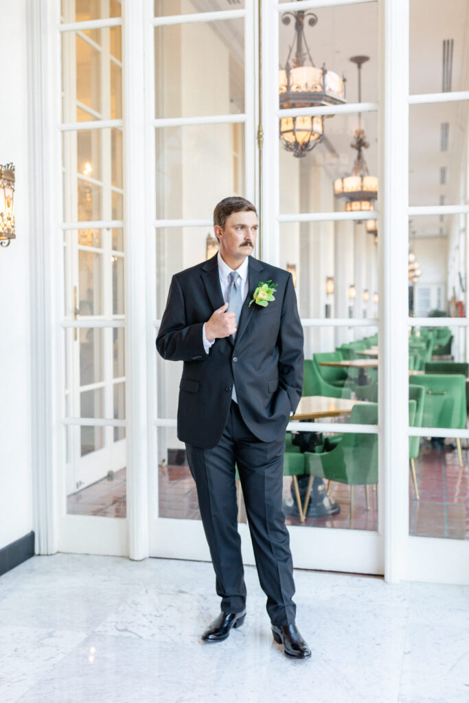 Groom in Gallery on the Park at St. Anthony Hotel