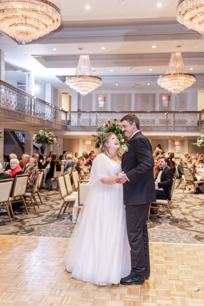 Bride and groom have their first dance in Anacacho Ballroom at St. Anthony Hotel