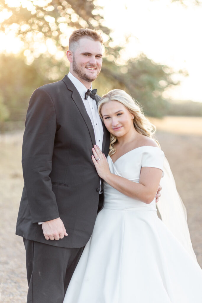 Classic bride and groom portrait in field