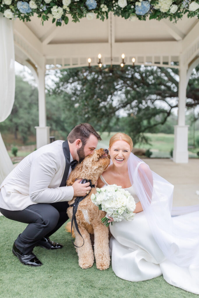 bride laughing with goldendoodle