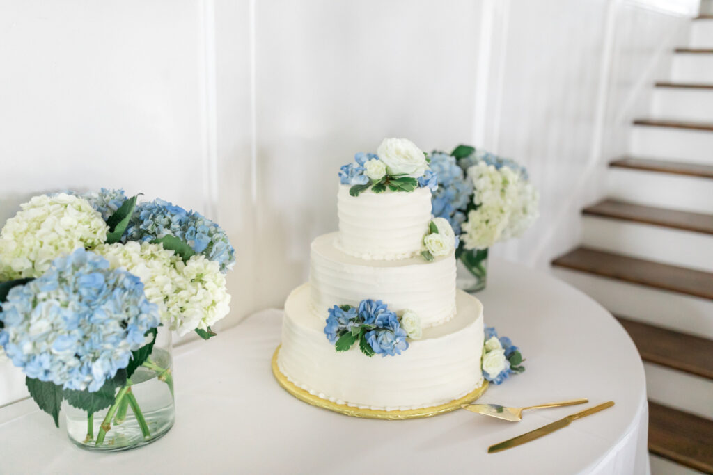 blue and white hydrangeas on wedding cake