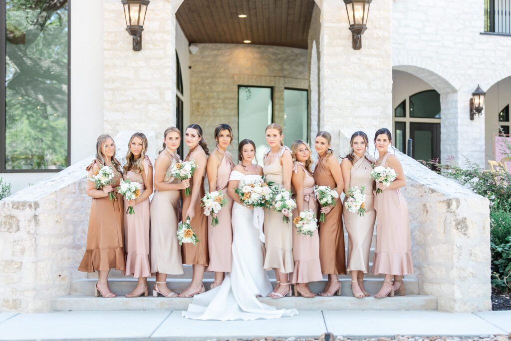 Bridal party with rose gold and blush dresses