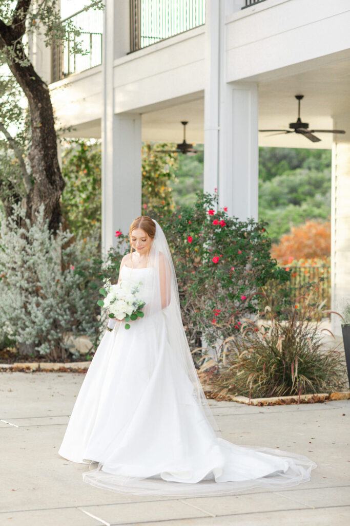 Bridal portrait in front of pillars at Kendall Point