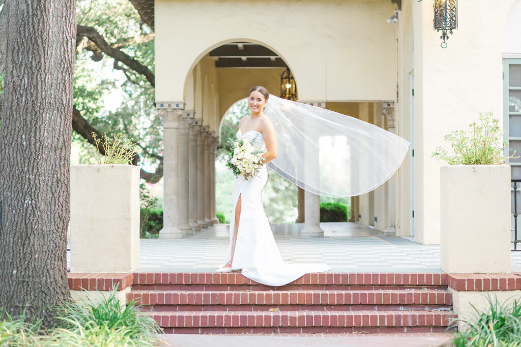 bride with veil blowing in the wind