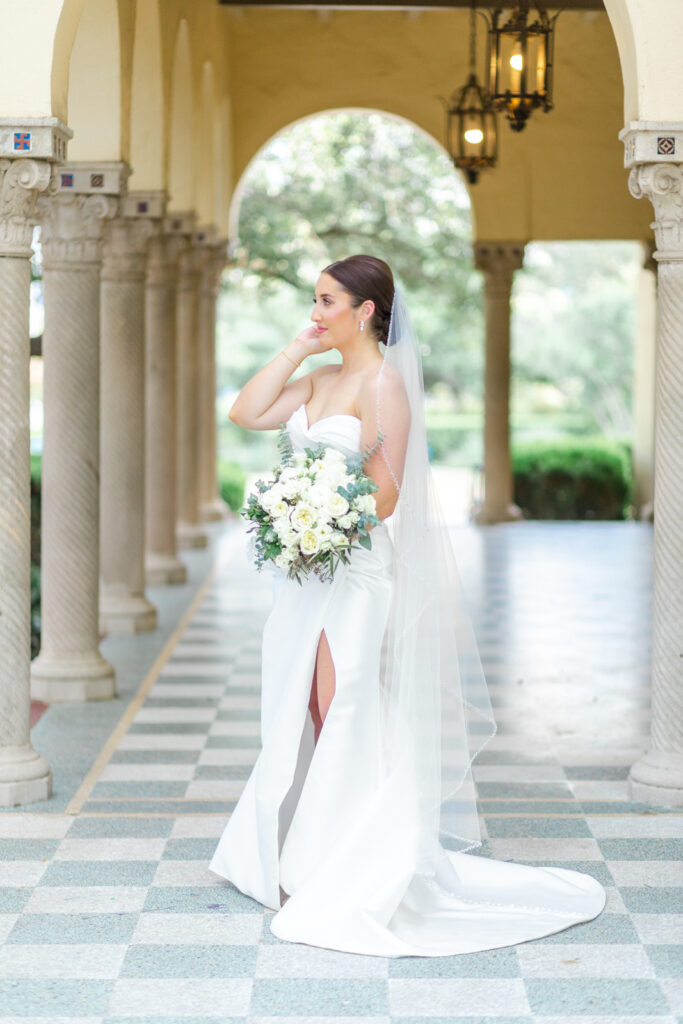 bride adjusting her bridal updo