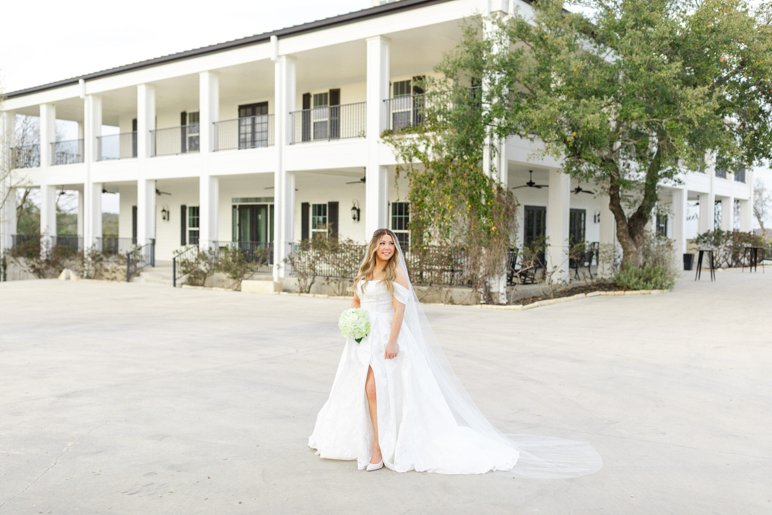 Bride in front of Kendall Point wedding venue